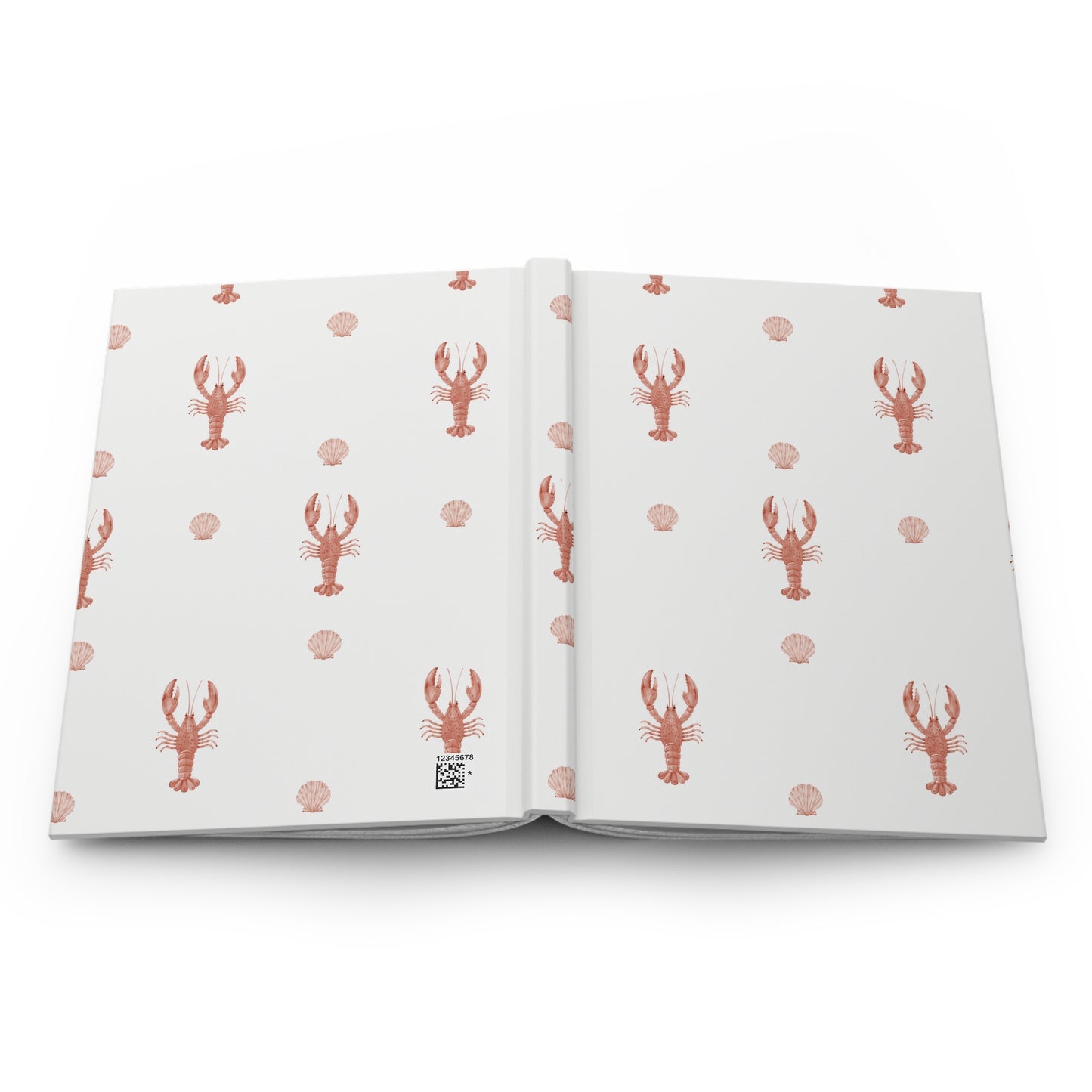 Open book with lobster and shell pattern on white pages