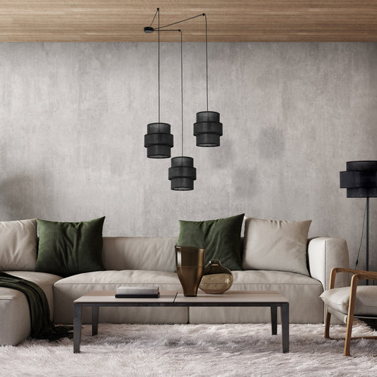 Black tiered pendant light shown in styled interior