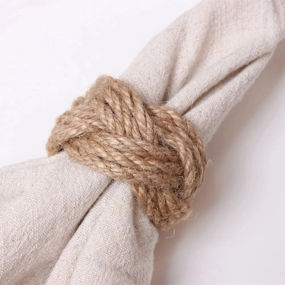 Close-up of handwoven jute napkin ring wrapped around napkin