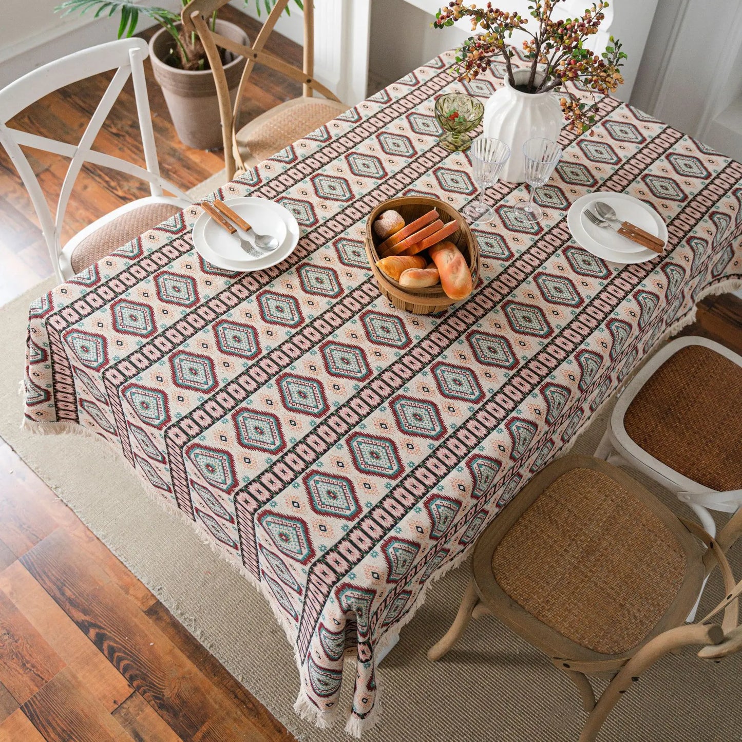 Overhead view of table styled with terracotta geometric tablecloth