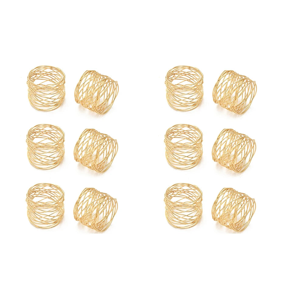 Set of 12 gold napkin rings on a white background