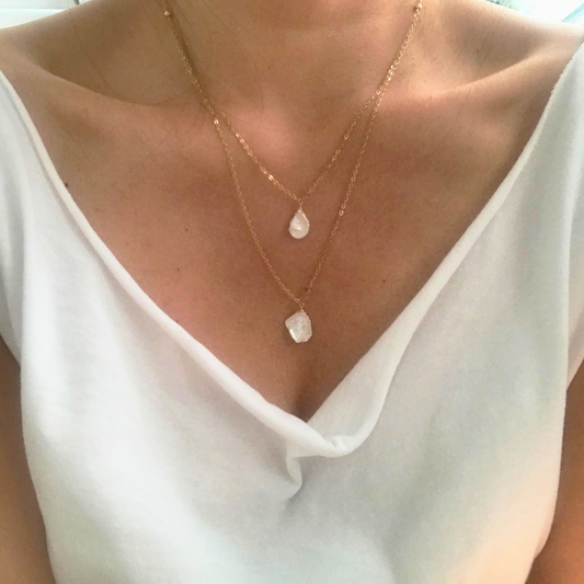 Keshi pearl necklace styled on neckline with draped blouse