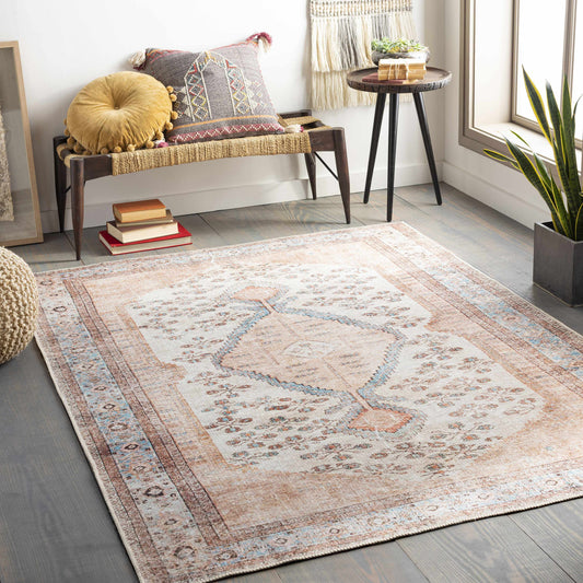 Moora medallion rug styled in entryway with bench and pillows