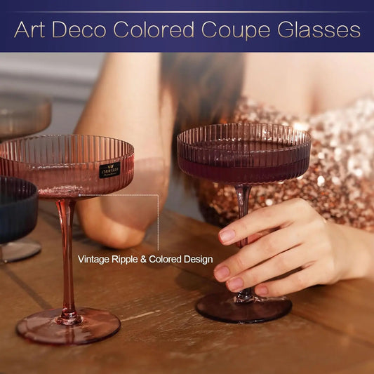 Person holding pink ribbed crystal coupe glass showing vintage ripple design and elegant stem