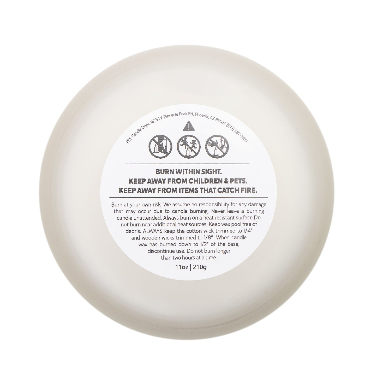 White candle with a label on a white background