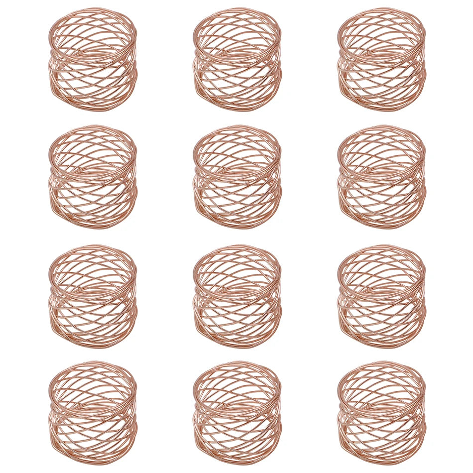 Set of rose gold wire napkin rings on a white background
