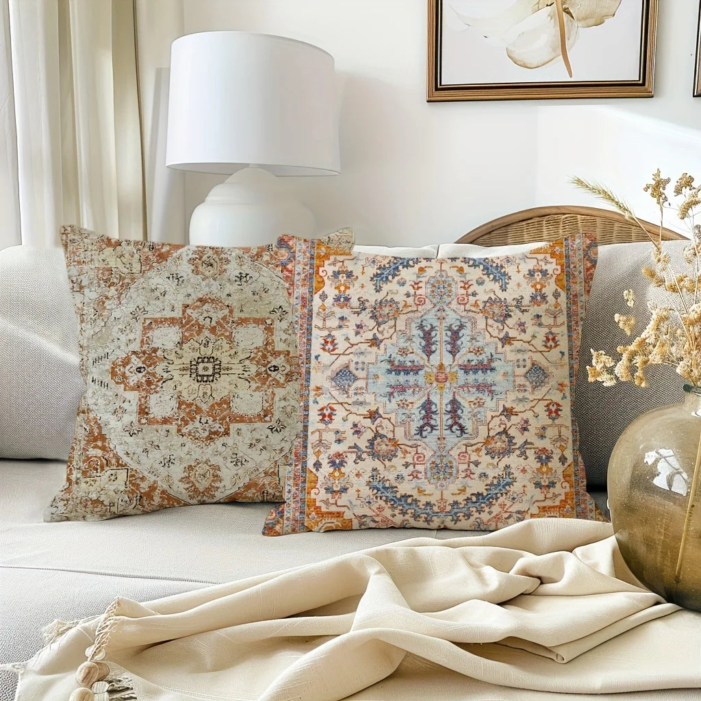 Decorative pillows with intricate patterns on a sofa in a living room setting.