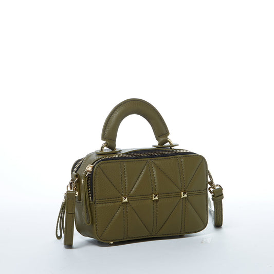 Side angle view of Taylor Small Quilted Crossbody Bag in olive green with quilted leather design and gold accents