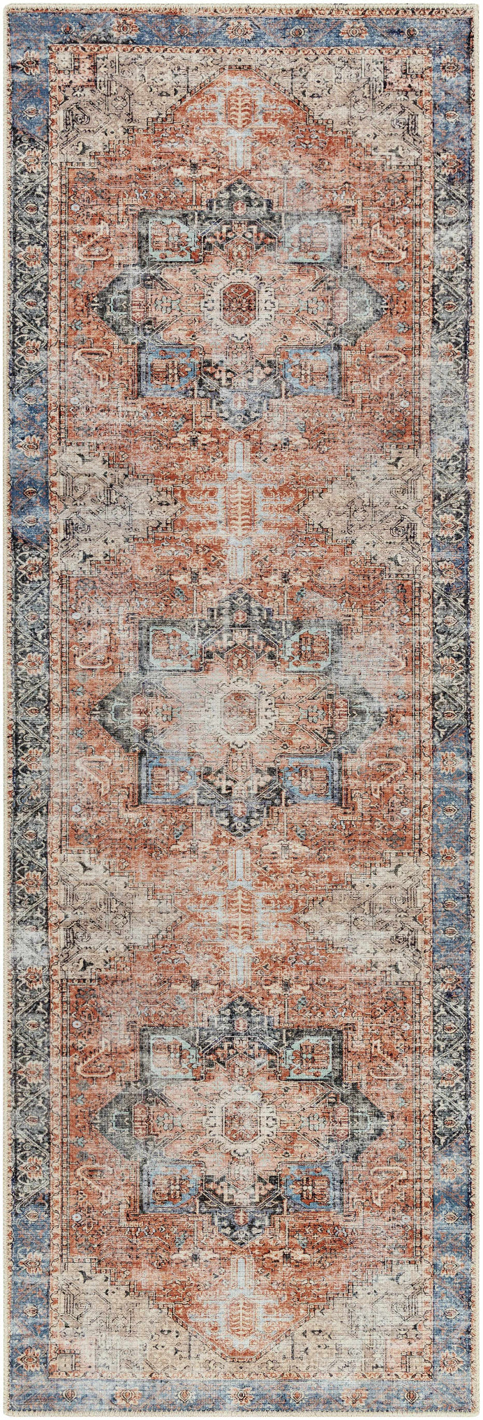 Decorative runner rug with intricate patterns in red, blue, and beige on a plain background