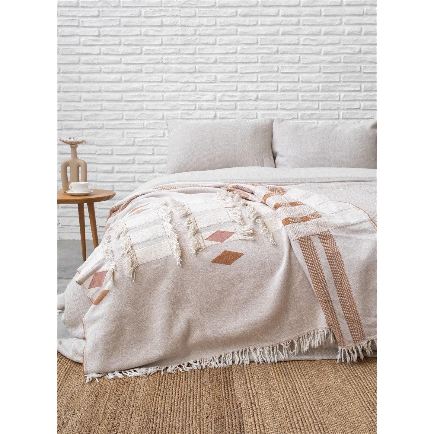 Lightweight cotton boho throw blanket with double-sided design, perfect for sofas, travel, or layering home decor.