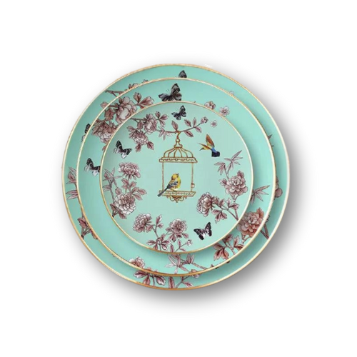 Luxurious bone china dinnerware set featuring intricate floral and birdcage motifs shown in mint green