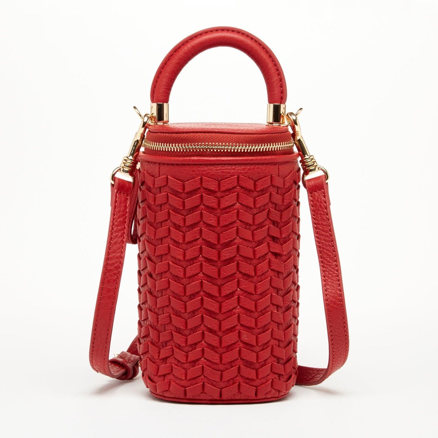 Red Italian leather basket weave crossbody bag by SUSU, featuring gold hardware, an adjustable strap, and a polka dot-lined interior.