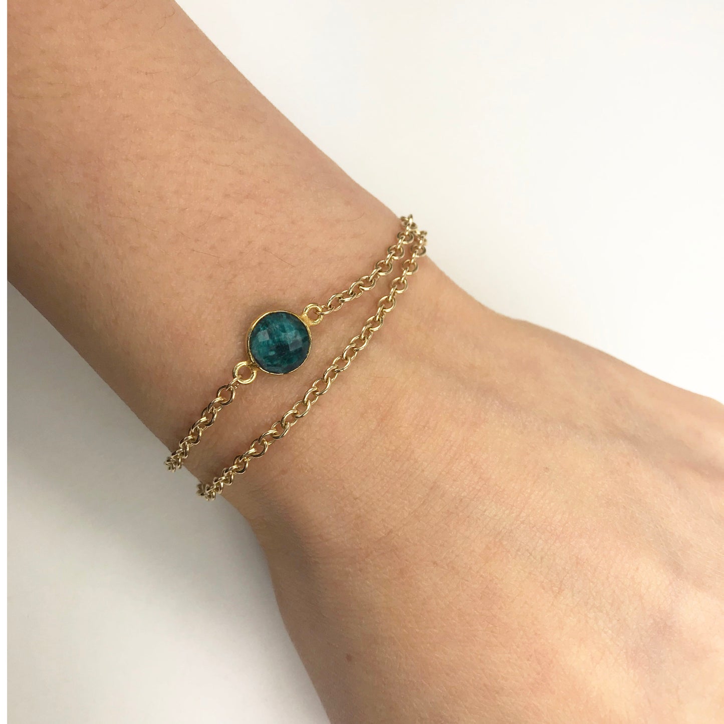 Emerald bracelet styled on wrist for scale and fit