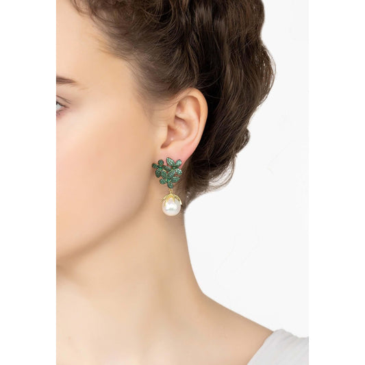 Elegant Flowers pearl earrings with gold plating and emerald green accents worn by a woman, showcasing their sophisticated floral design
