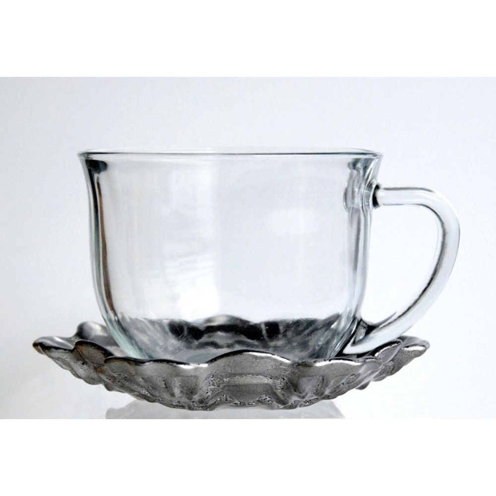 Luxury hand-gilded jumbo cup and saucer set in black and silver, featuring baroque-inspired engravings and a modern distressed finish.