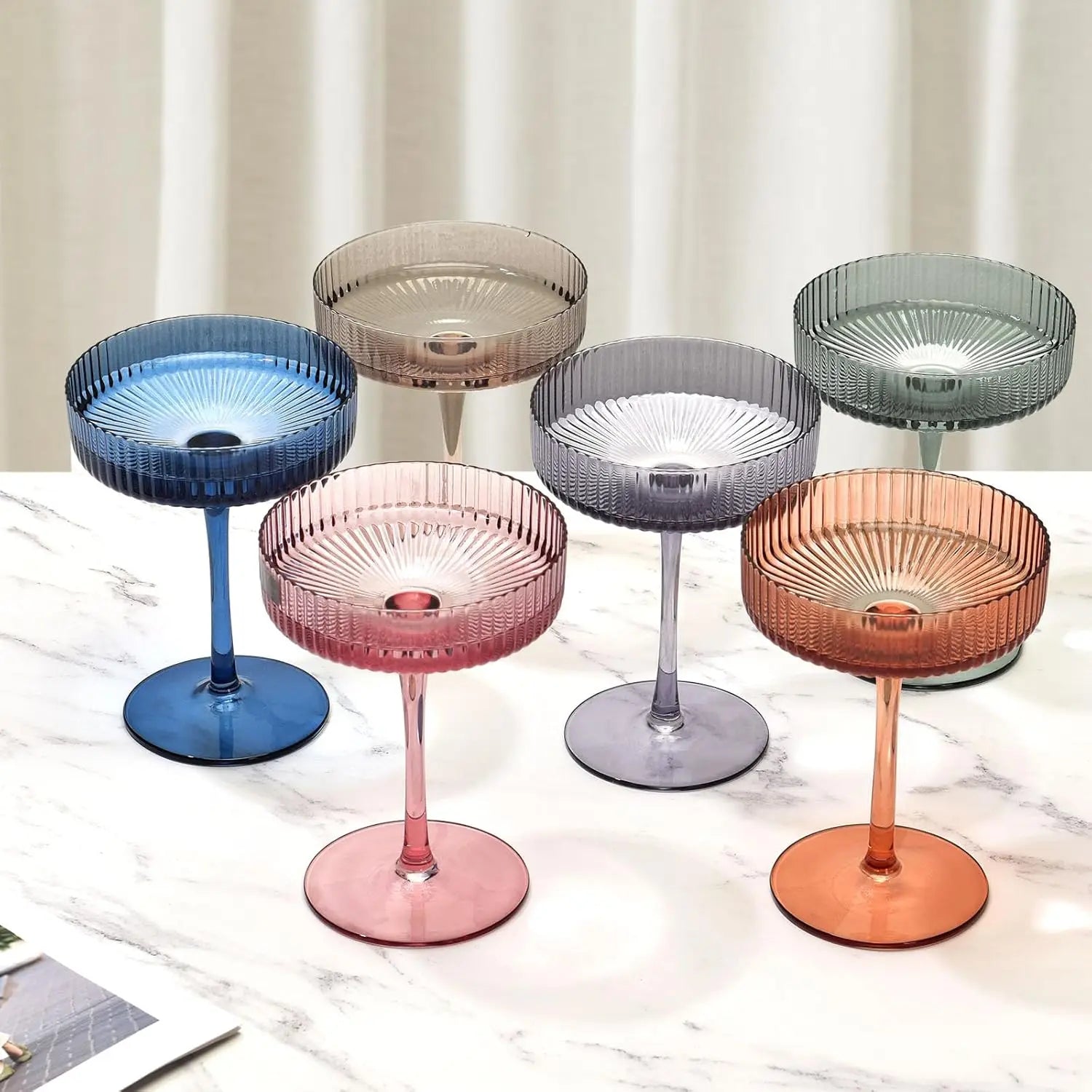 Artisan multicolored coupe glasses in lead-free crystal. Ribbed design, perfect for cocktails and special occasions.
