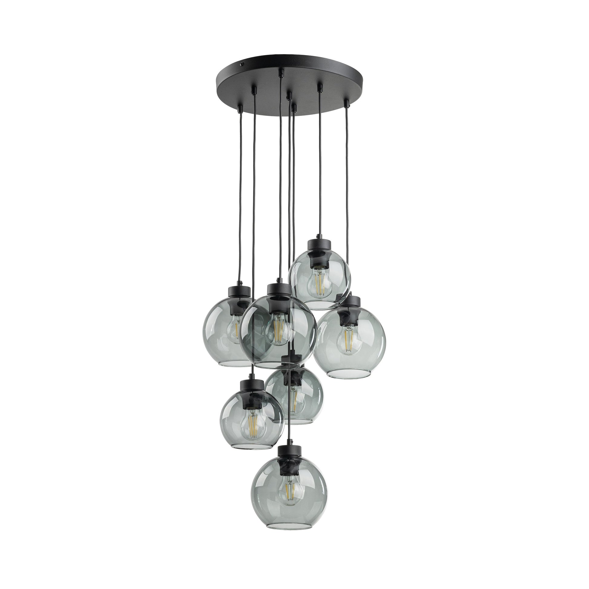 Modern pendant light with clear glass shades and black metal fixture on a white background