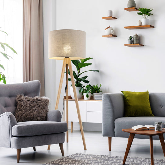 Modern living room with gray sofa, armchair, and decorative elements.