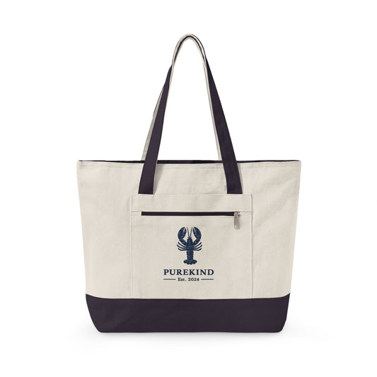 Beige tote bag with navy lobster accent and 'PUREKIND' logo on a white background