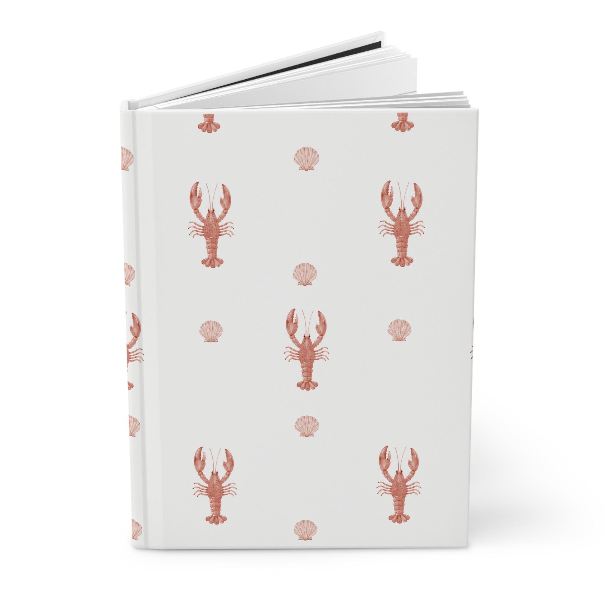 Notebook with red lobster and shell pattern on a white cover