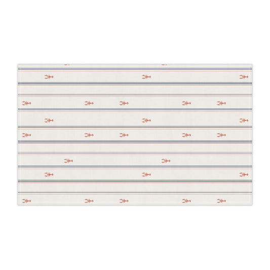 Striped fabric with small red lobster patterns on a cream background side