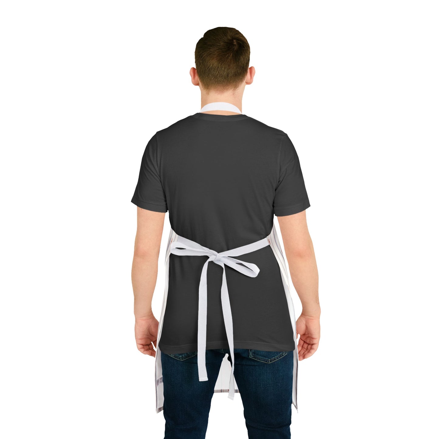 Person wearing a dark apron over a plain background
