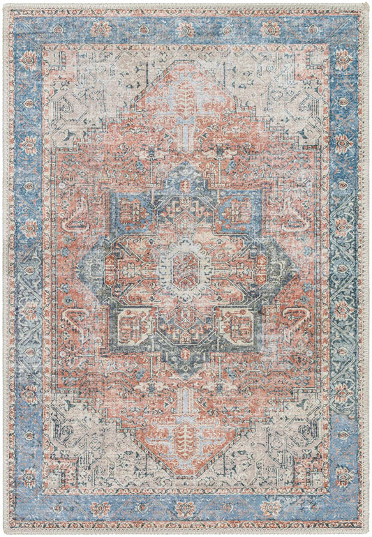 Decorative rug with a geometric pattern in blue, pink, and beige colors.