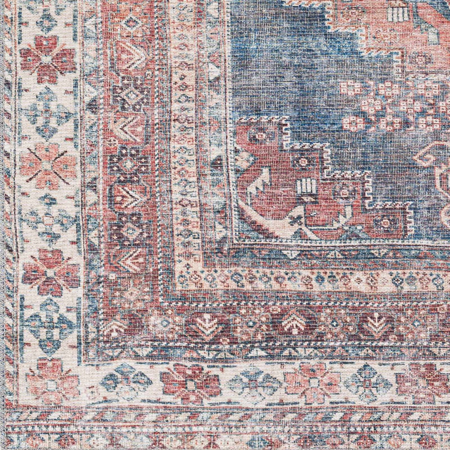 Detailed texture of Baltinglass washable rug in rust and blue tones