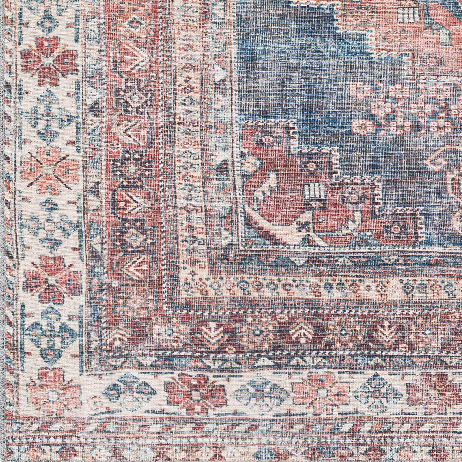 Detailed texture of Baltinglass washable rug in rust and blue tones