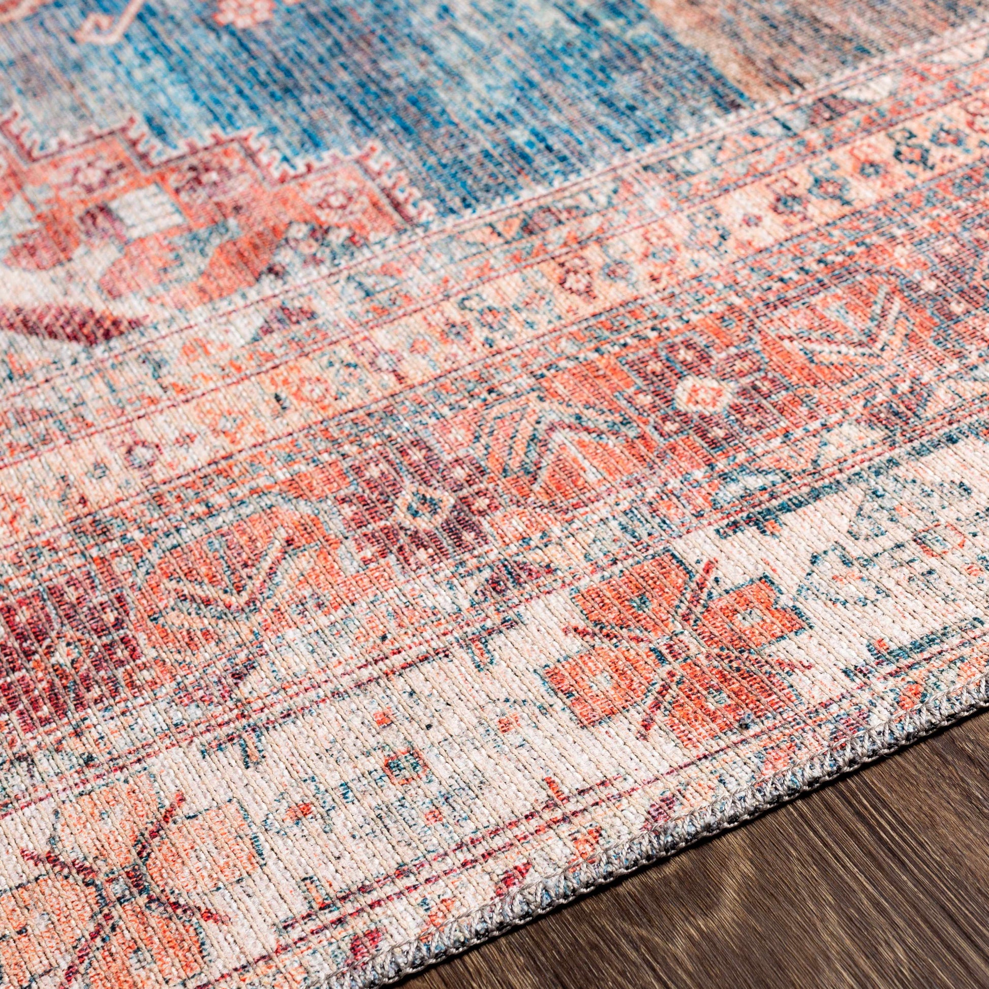 Close-up texture of Baltinglass washable rug in rust and blue tones
