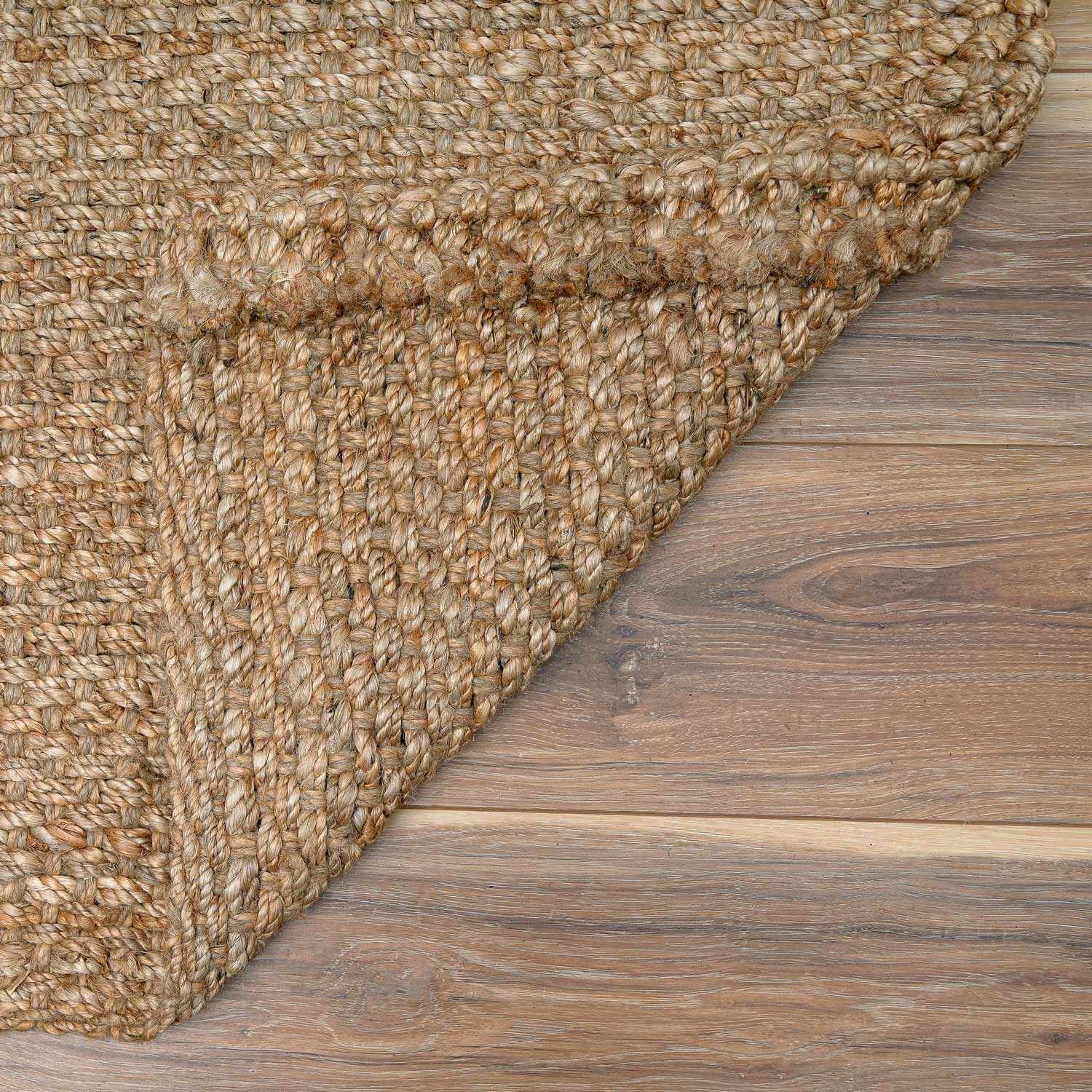 Corner fold detail of Herndon Braided Jute Rug showing craftsmanship and weave