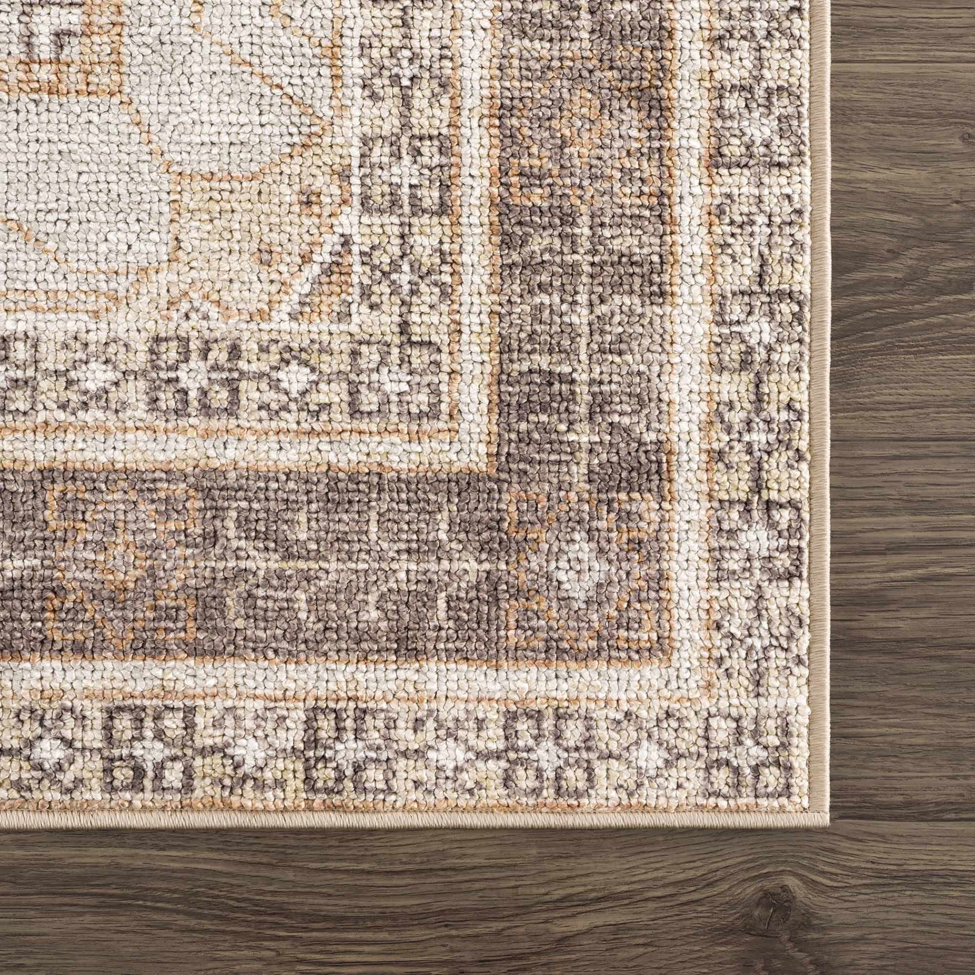 Close-up of a patterned rug on a wooden floor