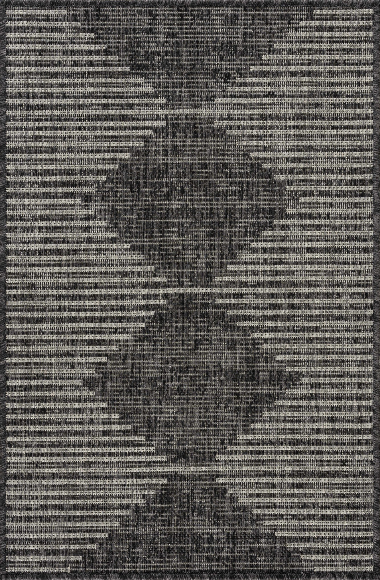 Textured black and white patterned rug with a geometric design
