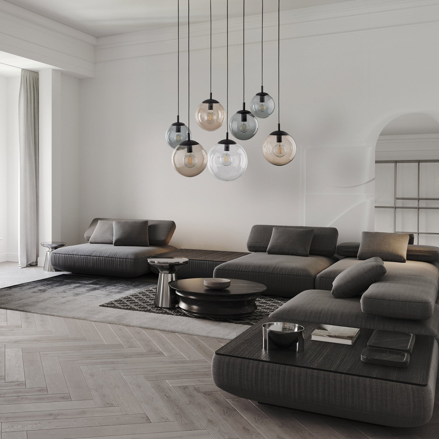  Modern Scandinavian living room with gray sectional sofa, round coffee table, and pendant lights.
