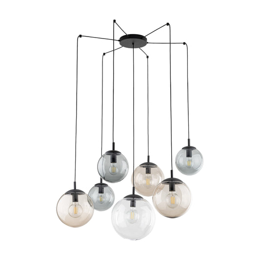 Close-up of Modern multi globe pendant light in graphite, topaz, and clear glass on a white background