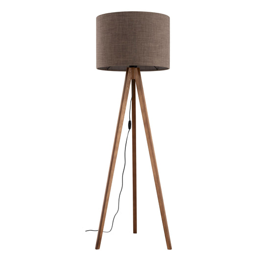 Floor lamp with brown fabric shade and wooden tripod base on a white background