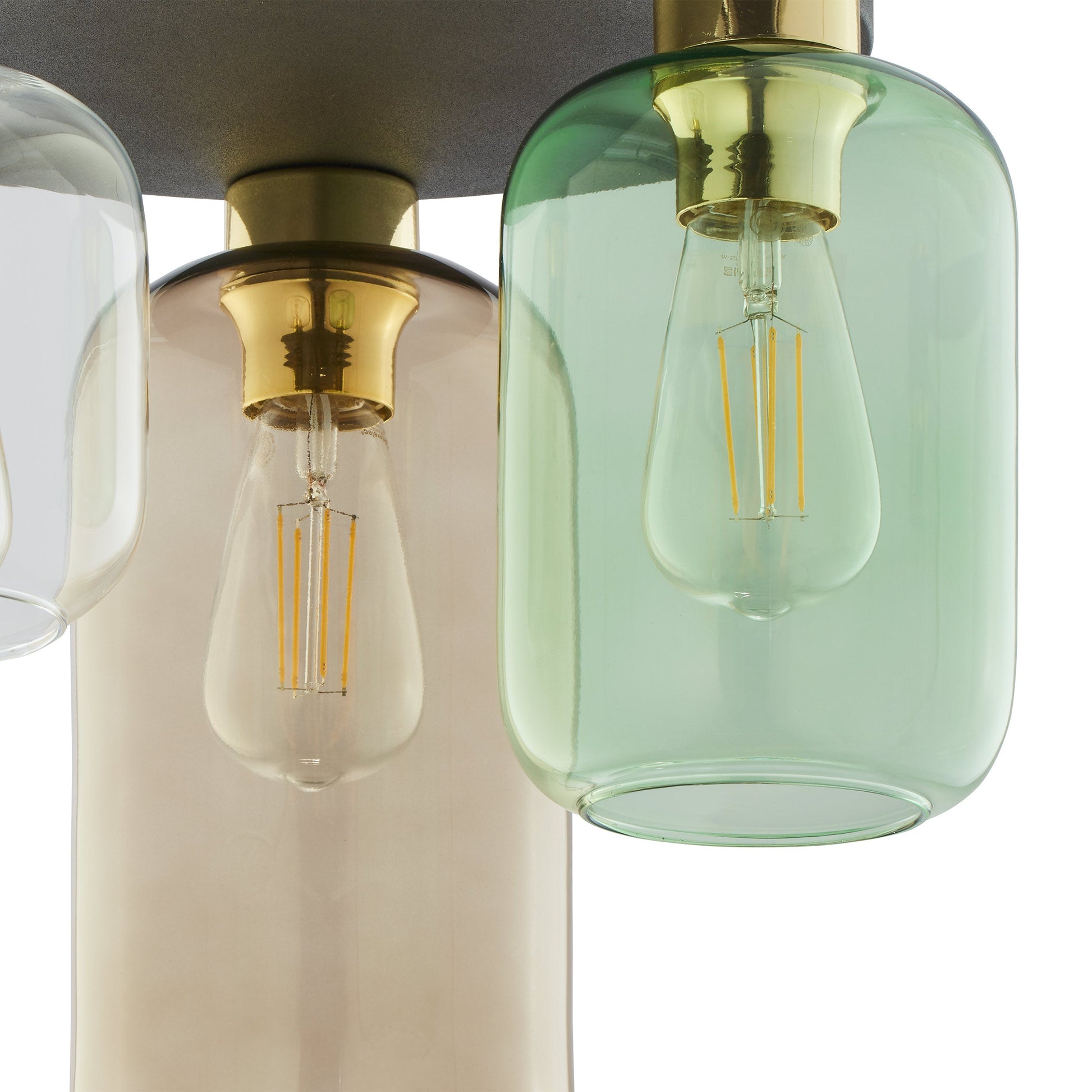 Detail of green and smoke brown glass shade with brass fittings