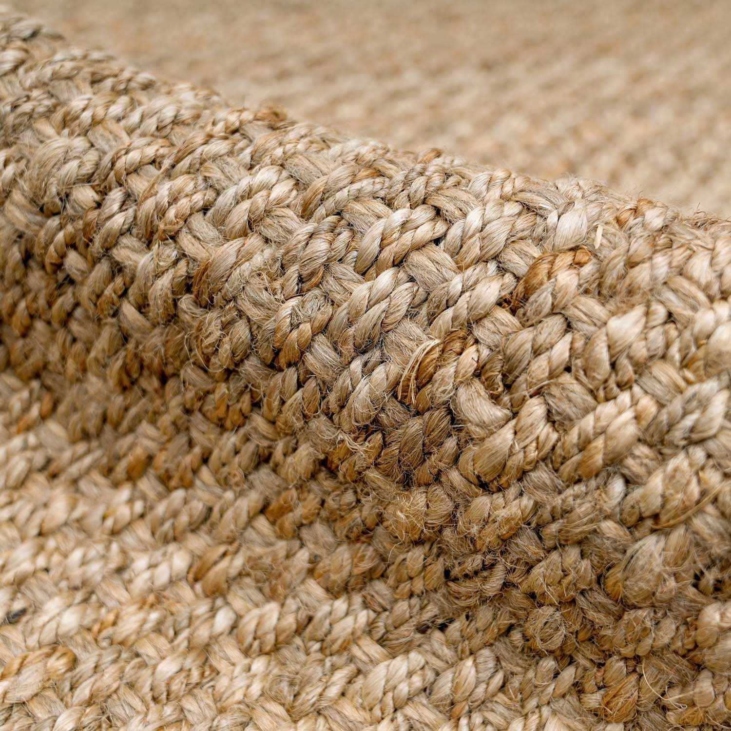  Close-up of Herndon Braided Jute Rug texture showing thick weave in natural jute fibers