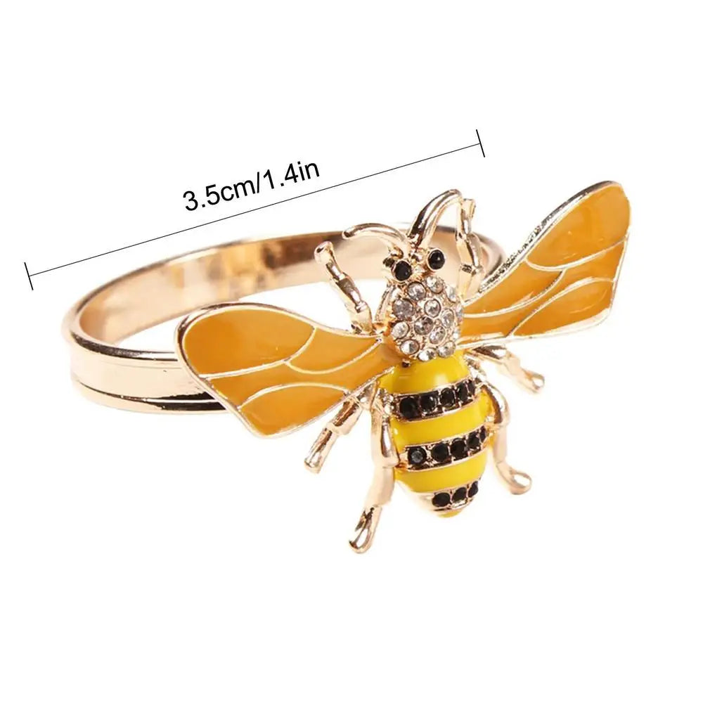 Gold honey bee napkin ring with yellow and black detailing and 3.5 cm width dimension