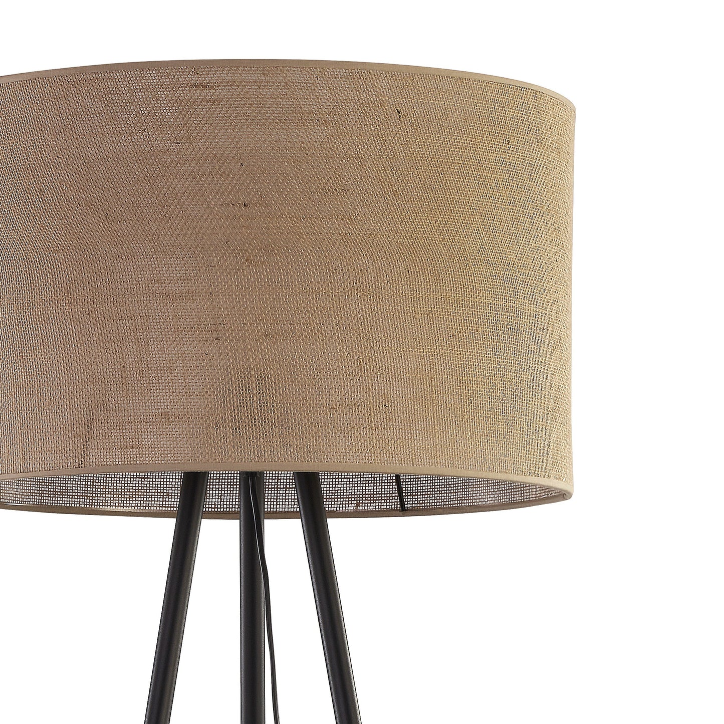 Lamp with a beige fabric shade and black metal legs on a white background