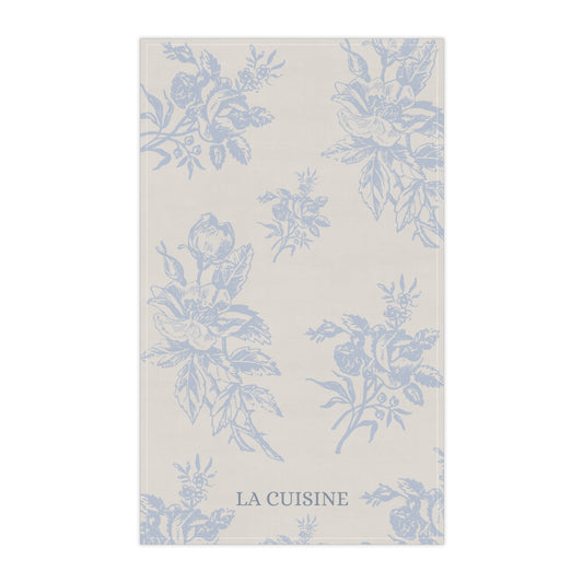 Floral patterned towel with 'La Cuisine' text on a white background