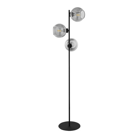 Modern black floor lamp with three glass shades on a white background