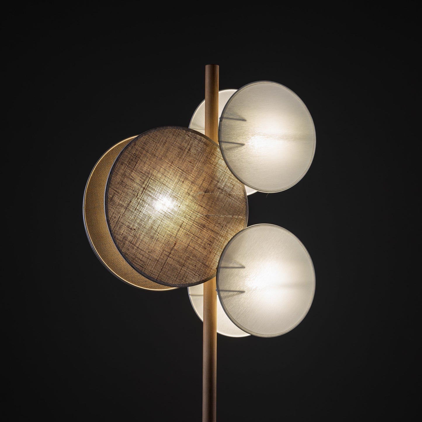 PULSE floor lamp lit in the dark, showing warm layered glow

