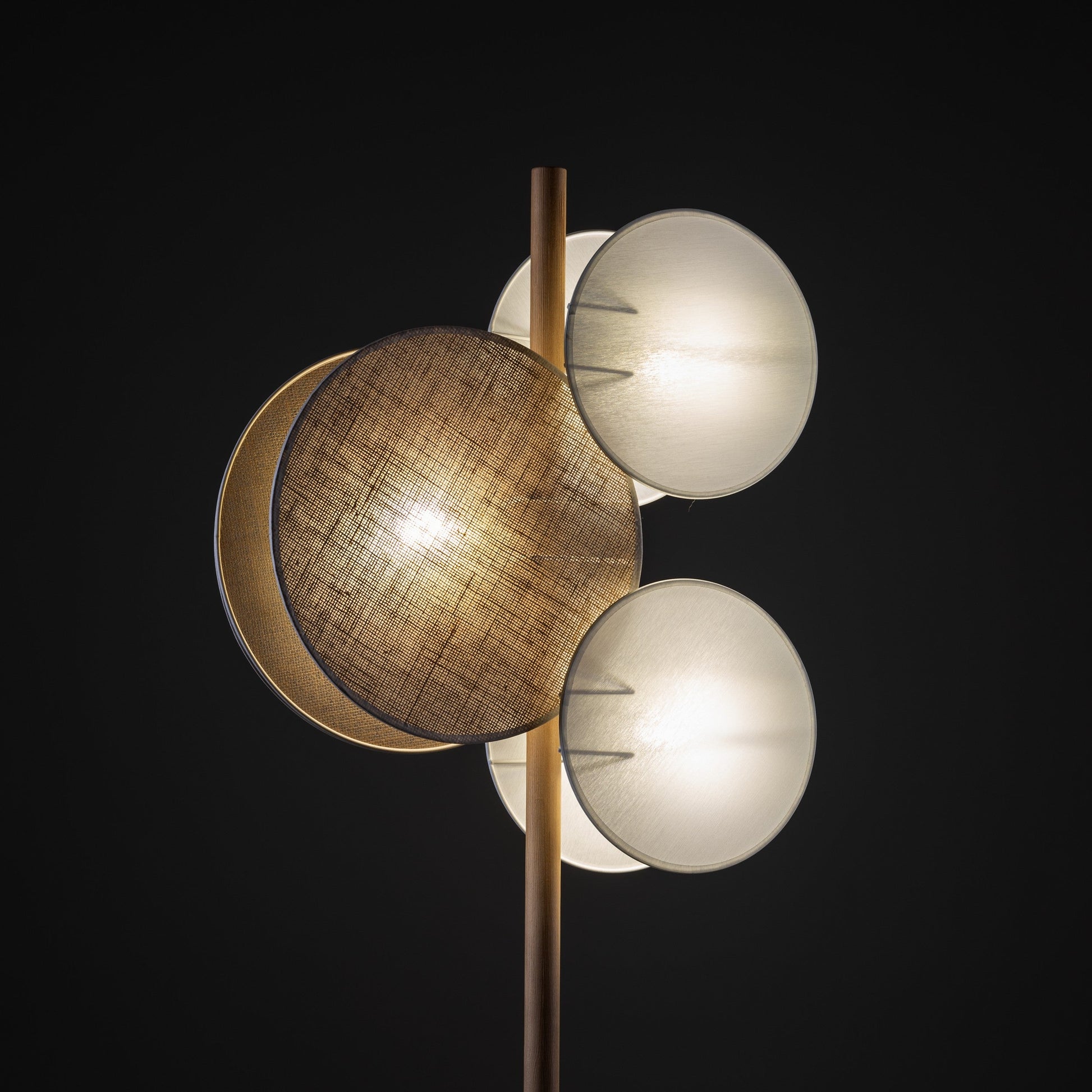 PULSE floor lamp lit in the dark, showing warm layered glow

