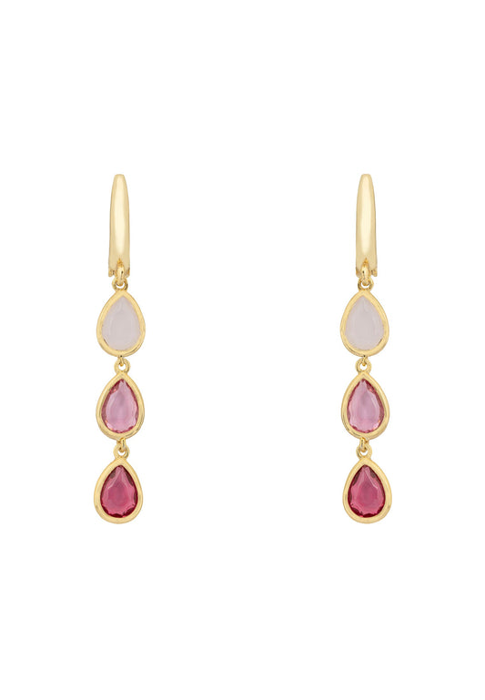 Gold earrings with pink and red gemstones on a white background