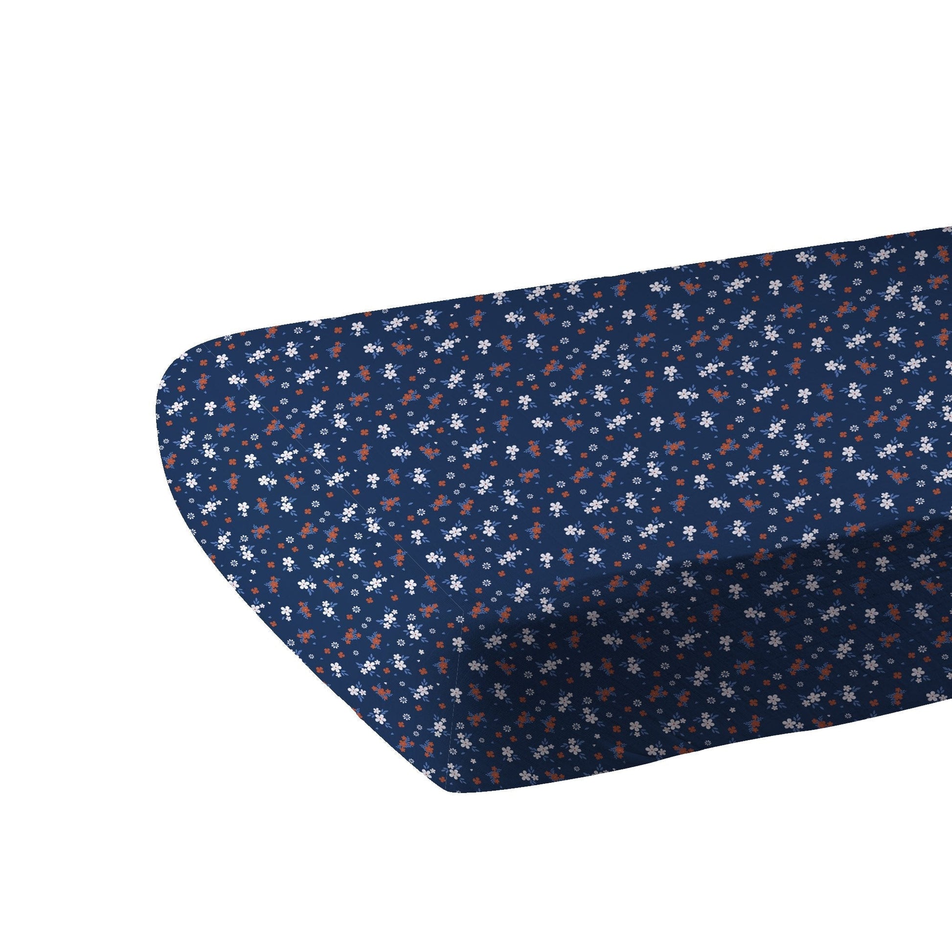 Navy blue fitted sheet with small white and red floral pattern on a white background