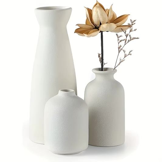 Set of 3 minimalist ceramic vases in white, perfect for modern home decor and styled with dried flowers.
