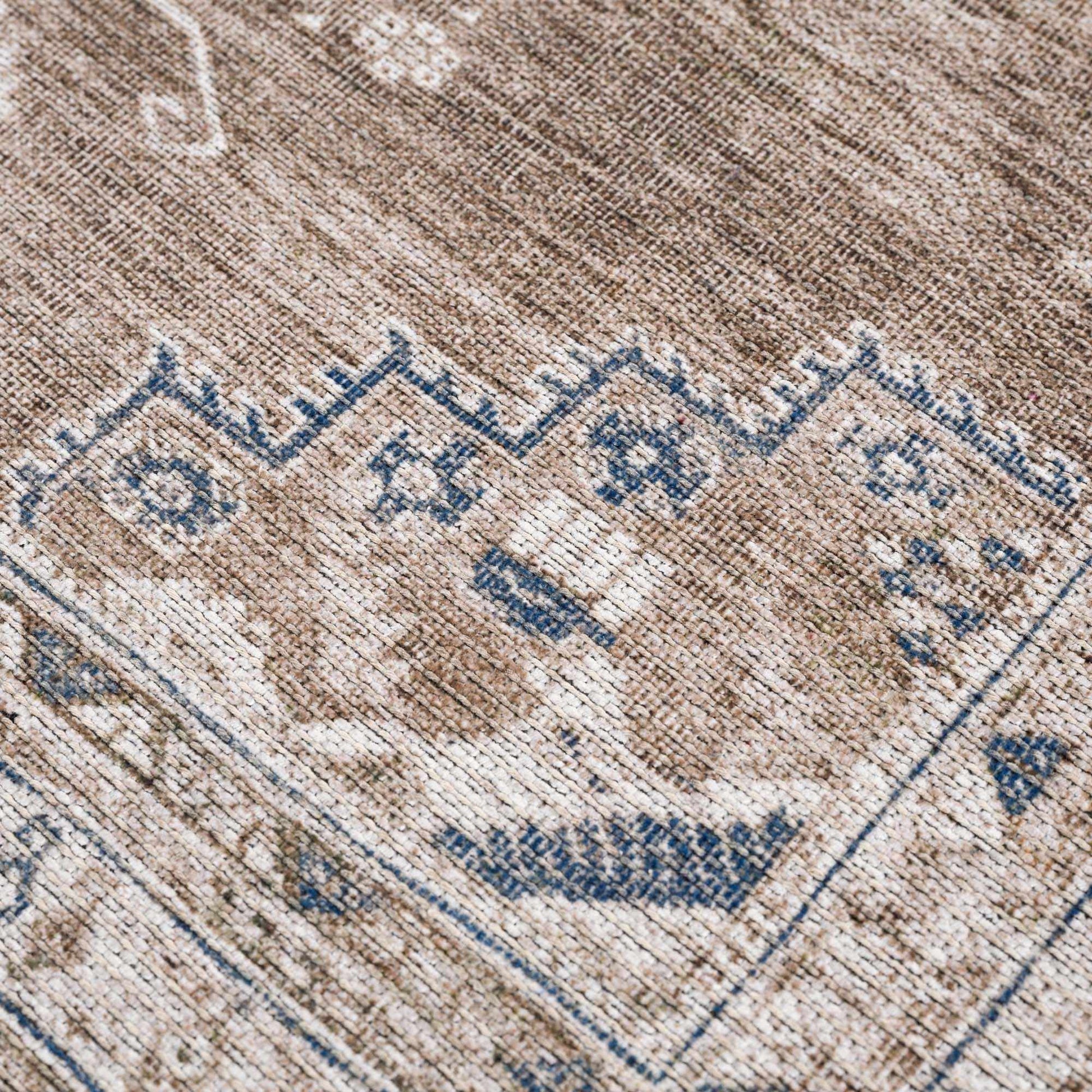 
Baltinglass rug texture in brown, cream, and blue tones