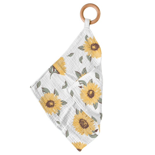 Sunflower print bamboo baby blankie with removable wooden teething ring, folded and hanging