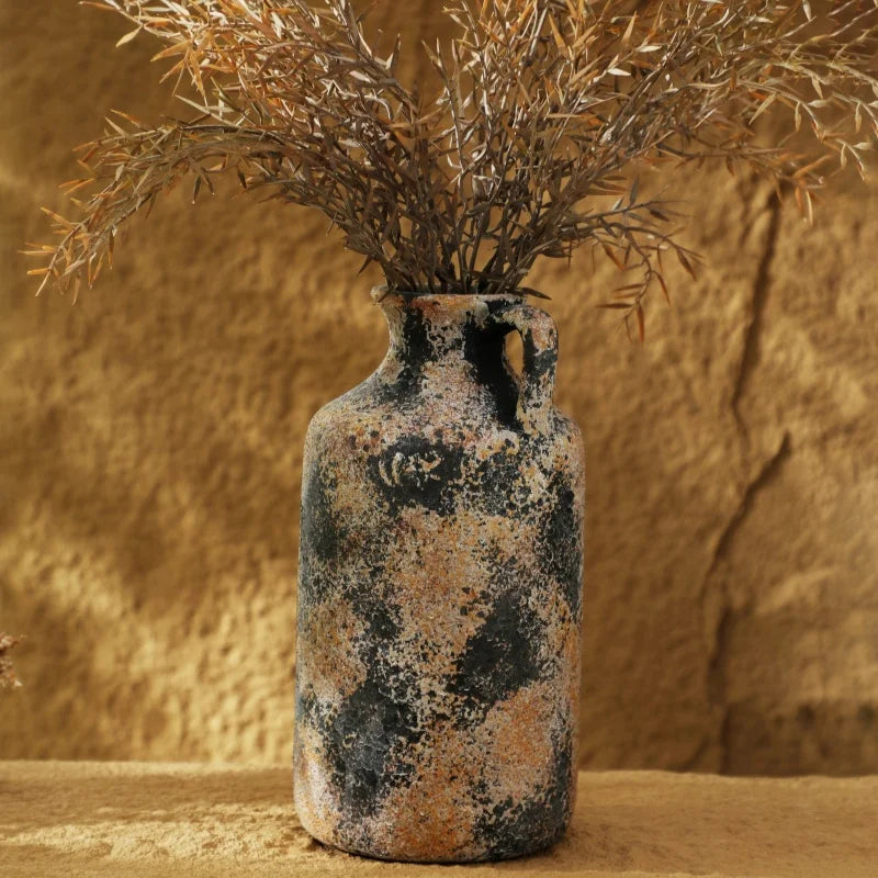 Tall ceramic vase styled with natural branches